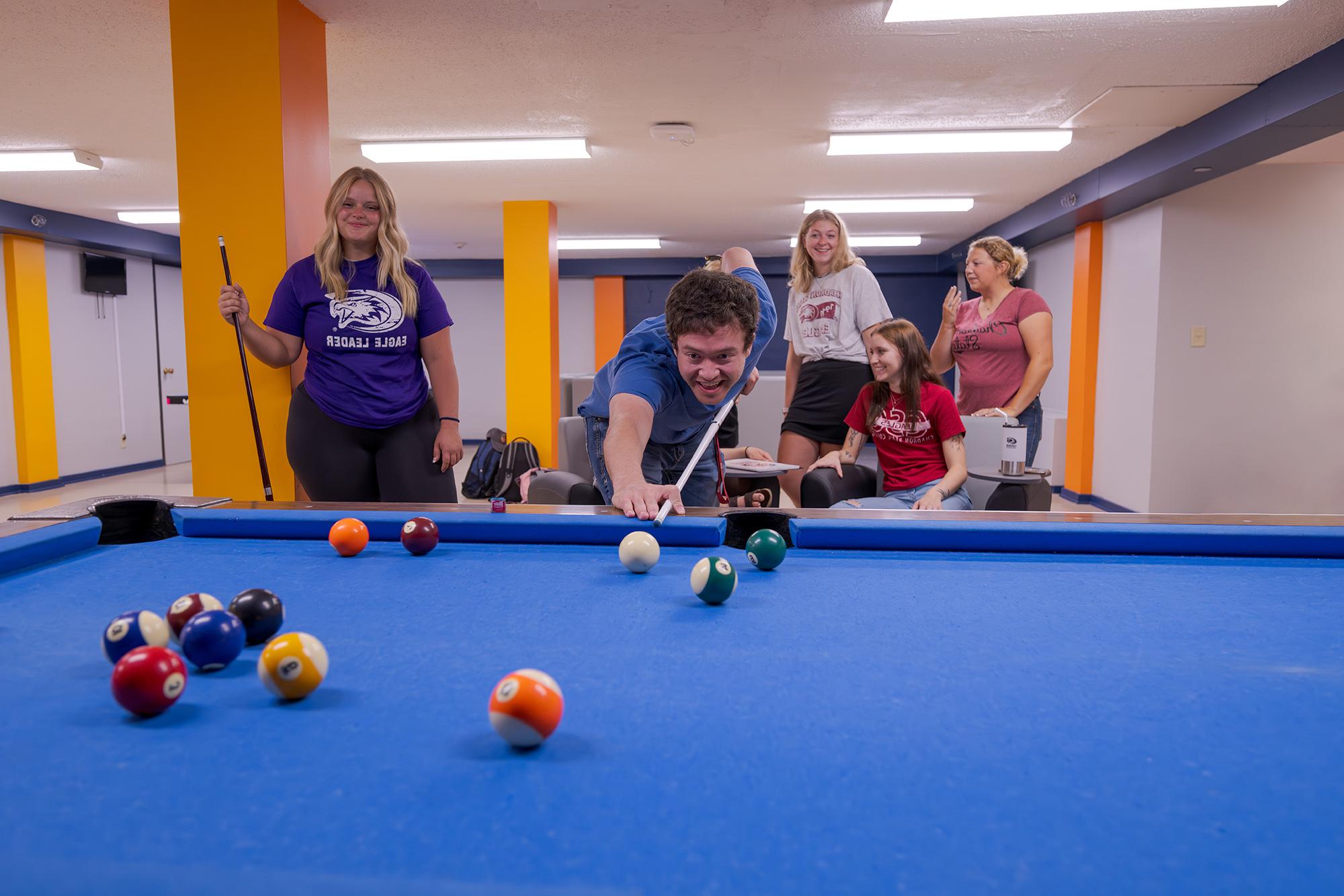 Students playing pool